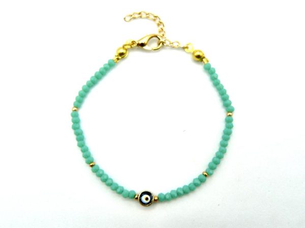 Gold-Plated Brass Bracelet With Turquoise Beads and Lobster Clasp Adjustable Closure. The Central Bead Has an Eye-Like Pattern and is Encased in a Layer of Gold-Plated Brass
