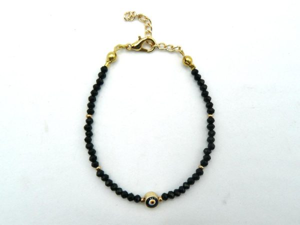 Gold-Plated Brass Bracelet With Black Beads and Lobster Clasp Adjustable Closure. The Central Bead Has an Eye-Like Pattern and is Encased in a Layer of Gold-Plated Brass